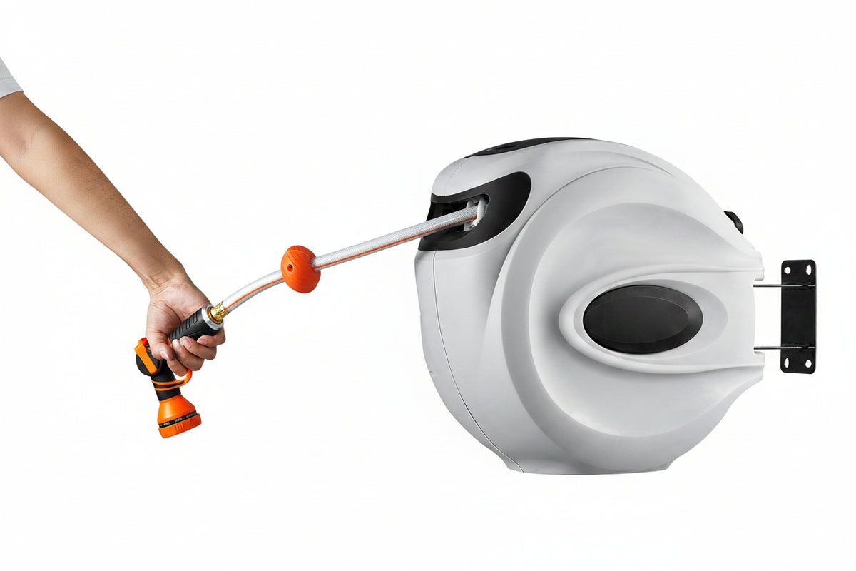 Hand holding a Vevor garden hose reel with a hose attached on a white background