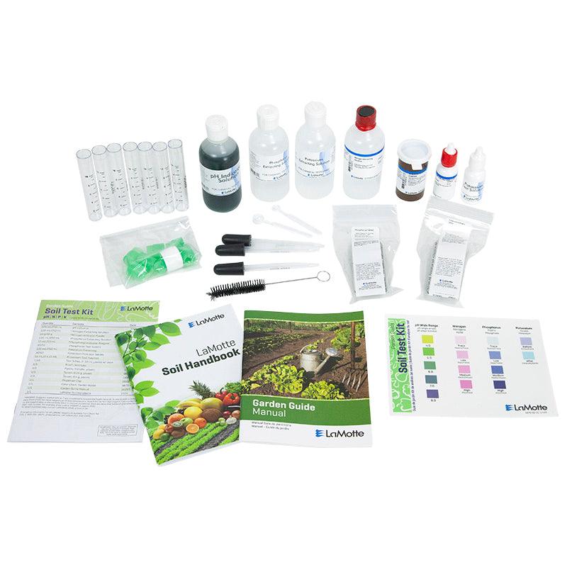 LaMotte soil test kit with bottles, test strips, and manuals on a white background