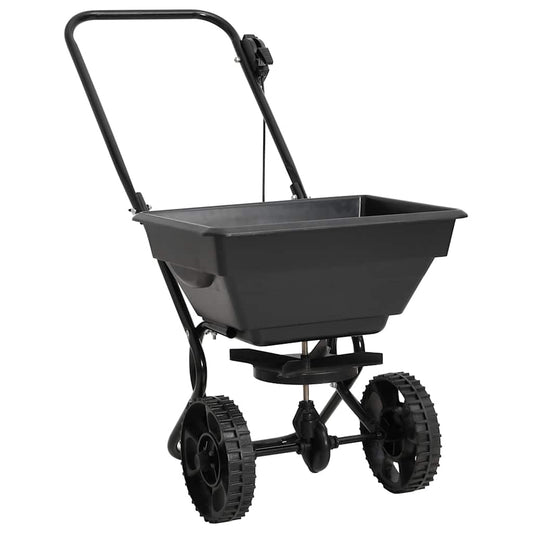Black lawn spreader on a white background
