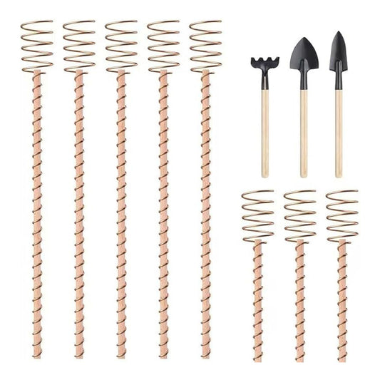 Set of metal plant support stakes with small gardening tools on a white background
