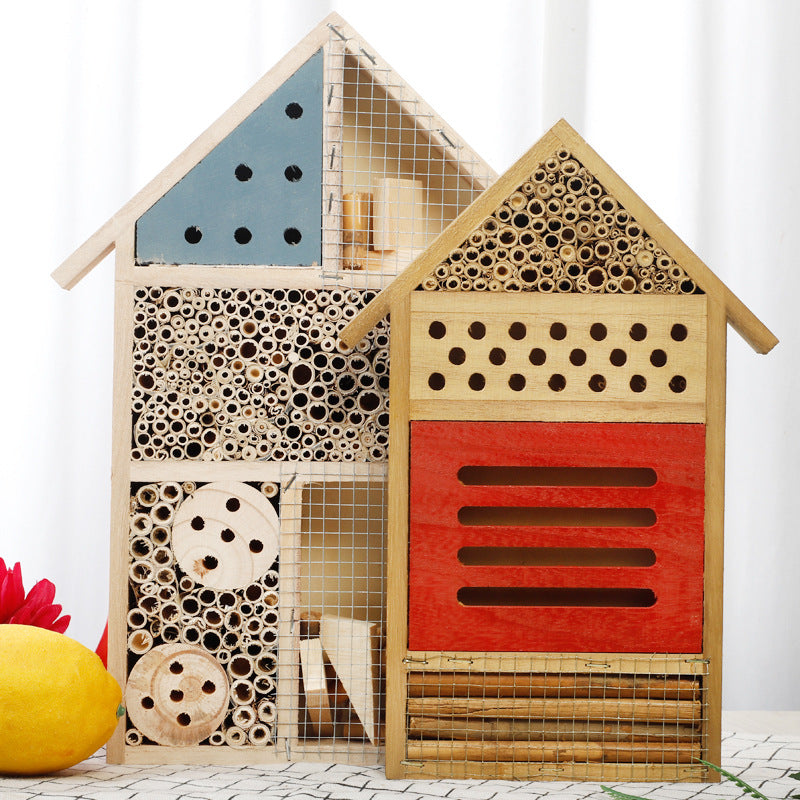 Two wooden bee houses with different designs on a white background