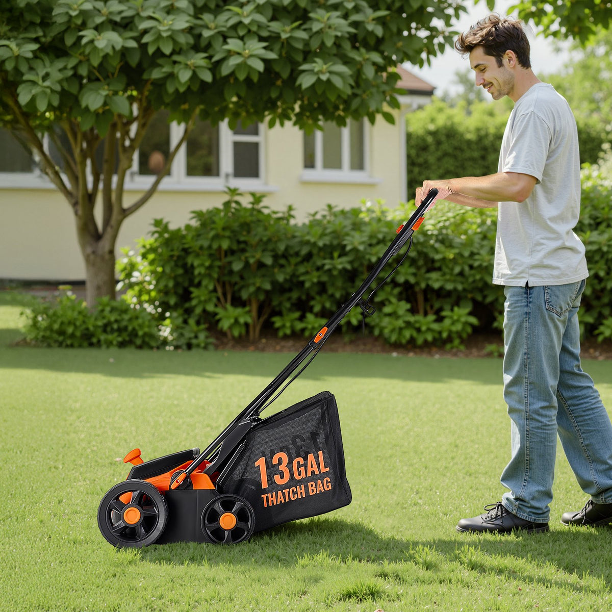 Man using a dethatcher with a large grass catcher bag in a garden setting.