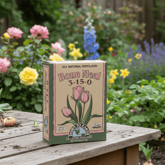 Box of Down to Earth Bone Meal fertilizer on a wooden table with flowers in the background