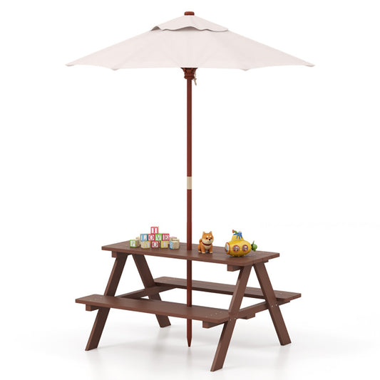 Children's wooden picnic table with umbrella and toys on a white background